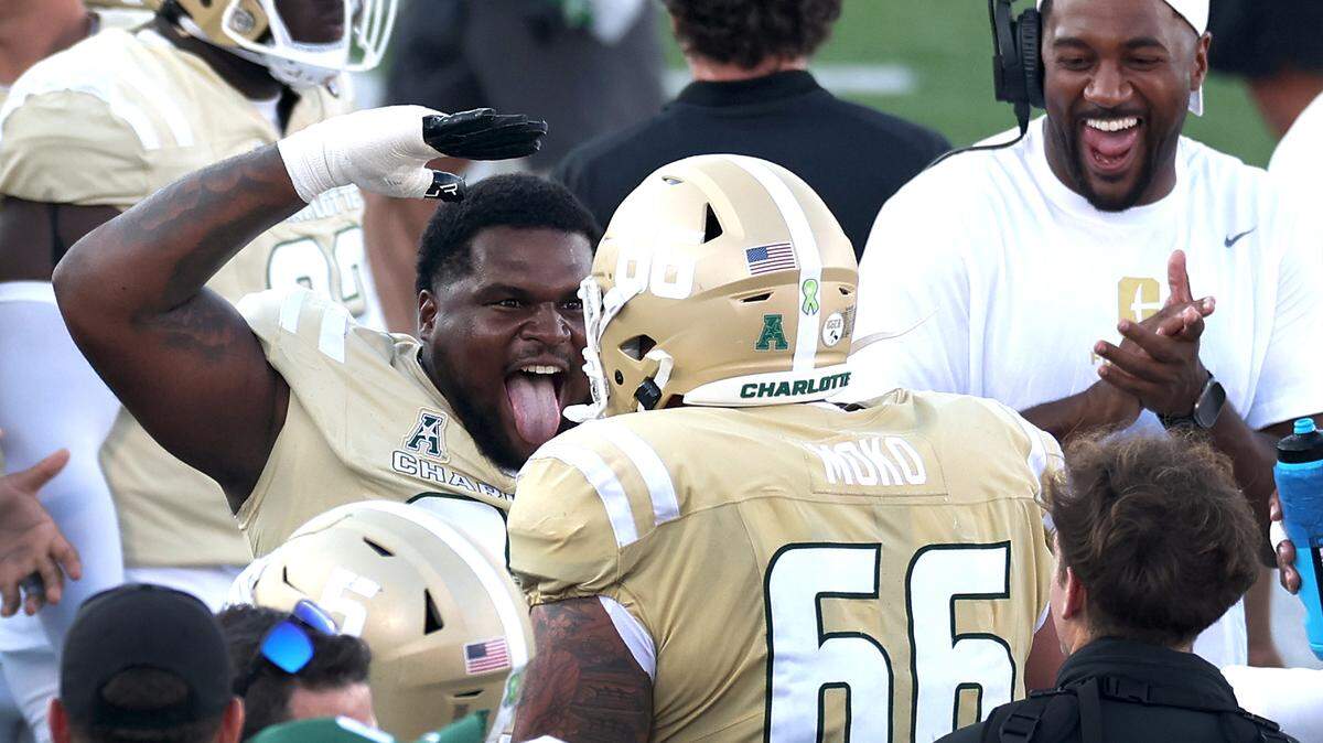 Charlotte 49ers defensive lineman Jamar Holley, center, celebrates the team’s play during fourth-quarter action against the East Carolina Pirates on Saturday, October 5, 2024 at Jerry Richardson Stadium in Charlotte, NC. The 49ers defeated ECU 55-24.