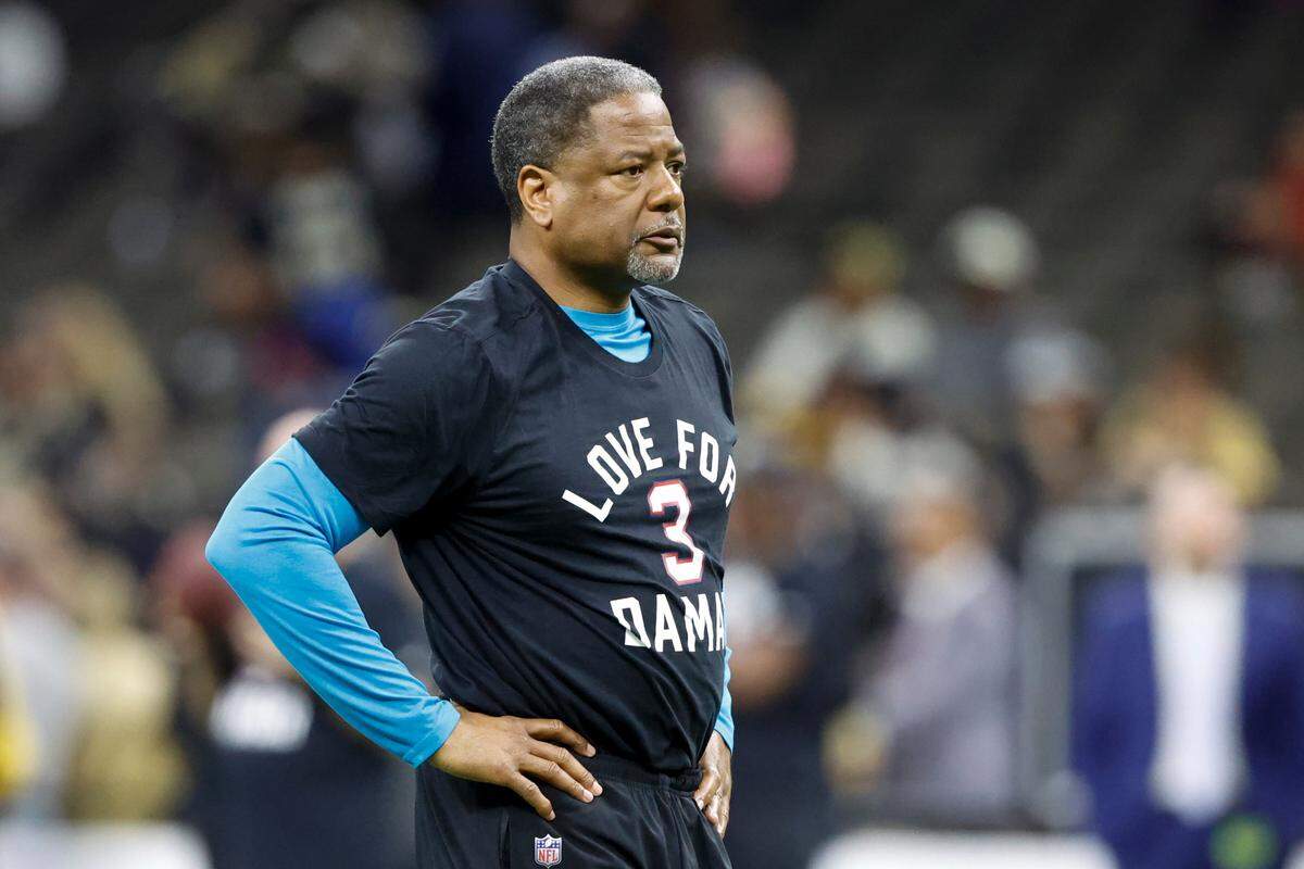Carolina Panthers interim head coach Steve Wilks wears a T-shirt in support of Buffalo Bills player Damar Hamlin before an NFL football game between the Carolina Panthers and the New Orleans Saints in New Orleans Sunday. The Panthers won, 10-7, to finish the regular season 7-10.