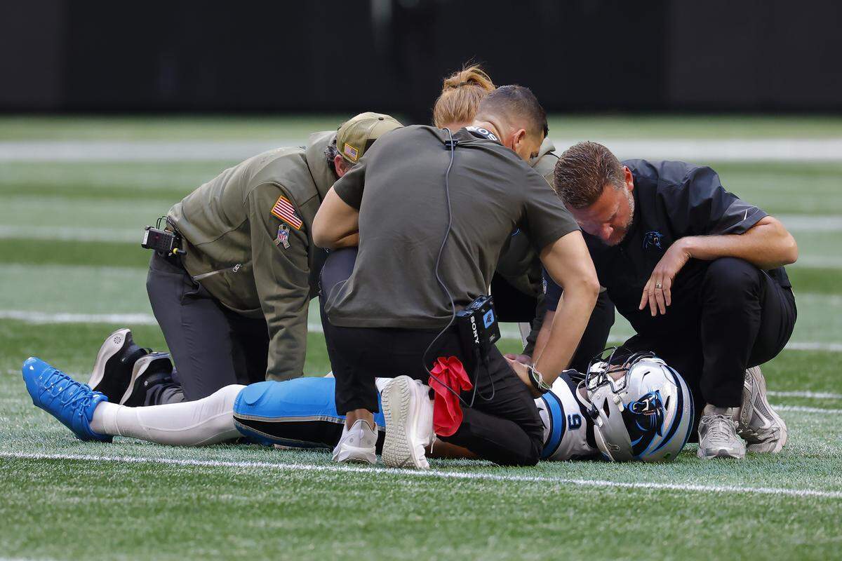 Carolina Panthers QB Bryce Young is down on the field with an apparent injury during Sunday’s first quarter against the Atlanta Falcons at Mercedes-Benz Stadium.