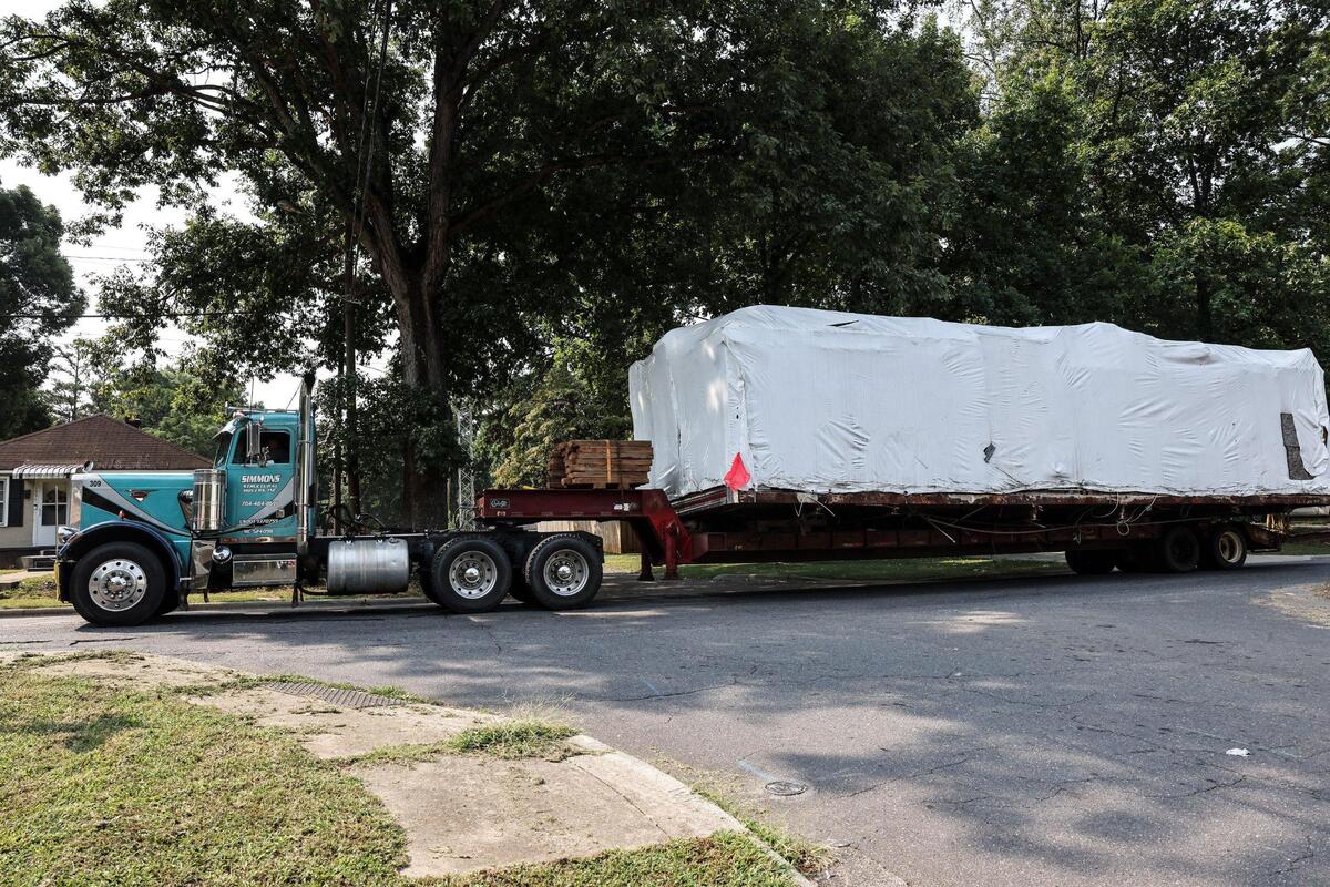 Mattie’s Diner, which closed five years ago, is moved Monday from its storage site at the corner of Double Oaks and Newland roads to 3100 The Plaza, about 3 miles away, in Charlotte.
