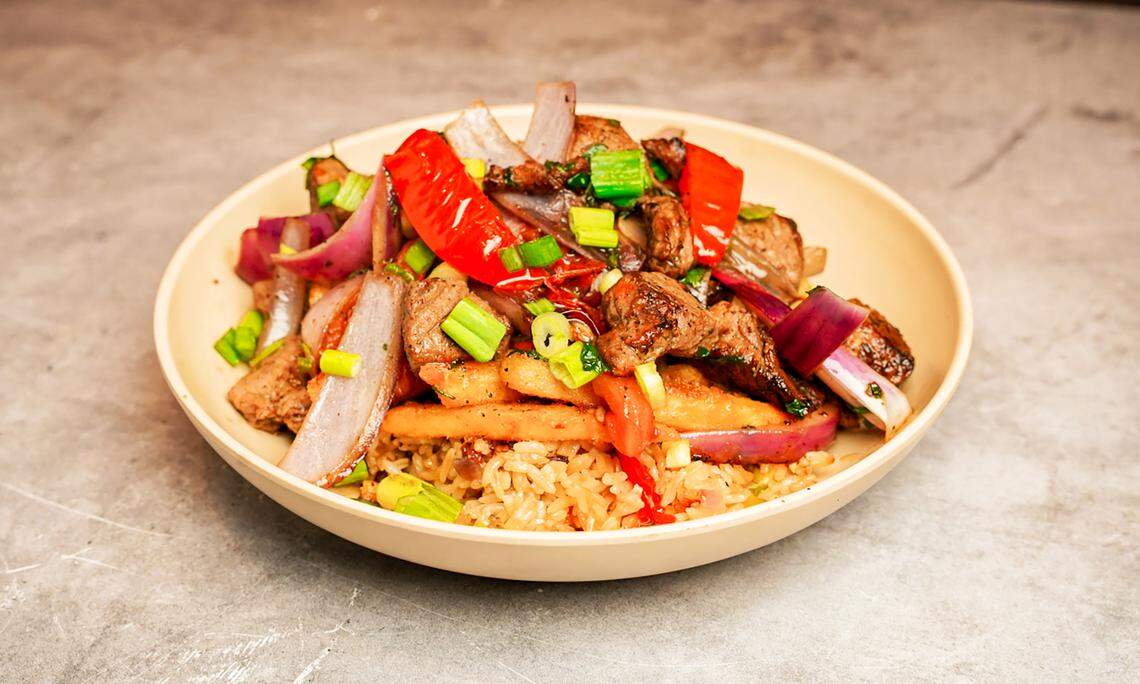The Chinito Saltado is a Chifa-style stirfry dish with sirloin, onions, tomato and herbs atop French fries and Viva’s signature arroz chuafa (Peruvian fried rice with red peppers, green onions, eggs, ginger and soy sauce). Chifa cuisine is a fusion of Chinese Cantonese and Peruvian ingredients.