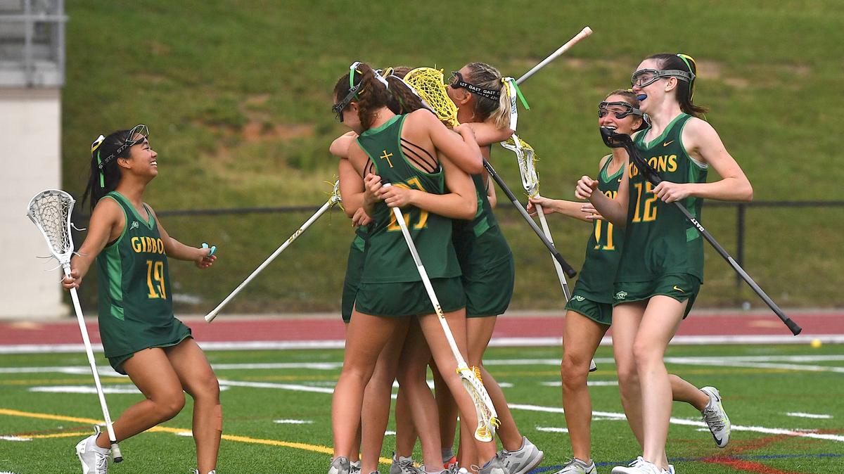 The Cardinal Gibbons Crusaders celebrate after their defeat of Charlotte Catholic in the NCHSAA 4A Lacrosse Finals. Cardinal Gibbons and Charlotte Catholic met in the NCHSAA 4A Girls Lacrosse Final at Durham County Stadium on May 17, 2024.