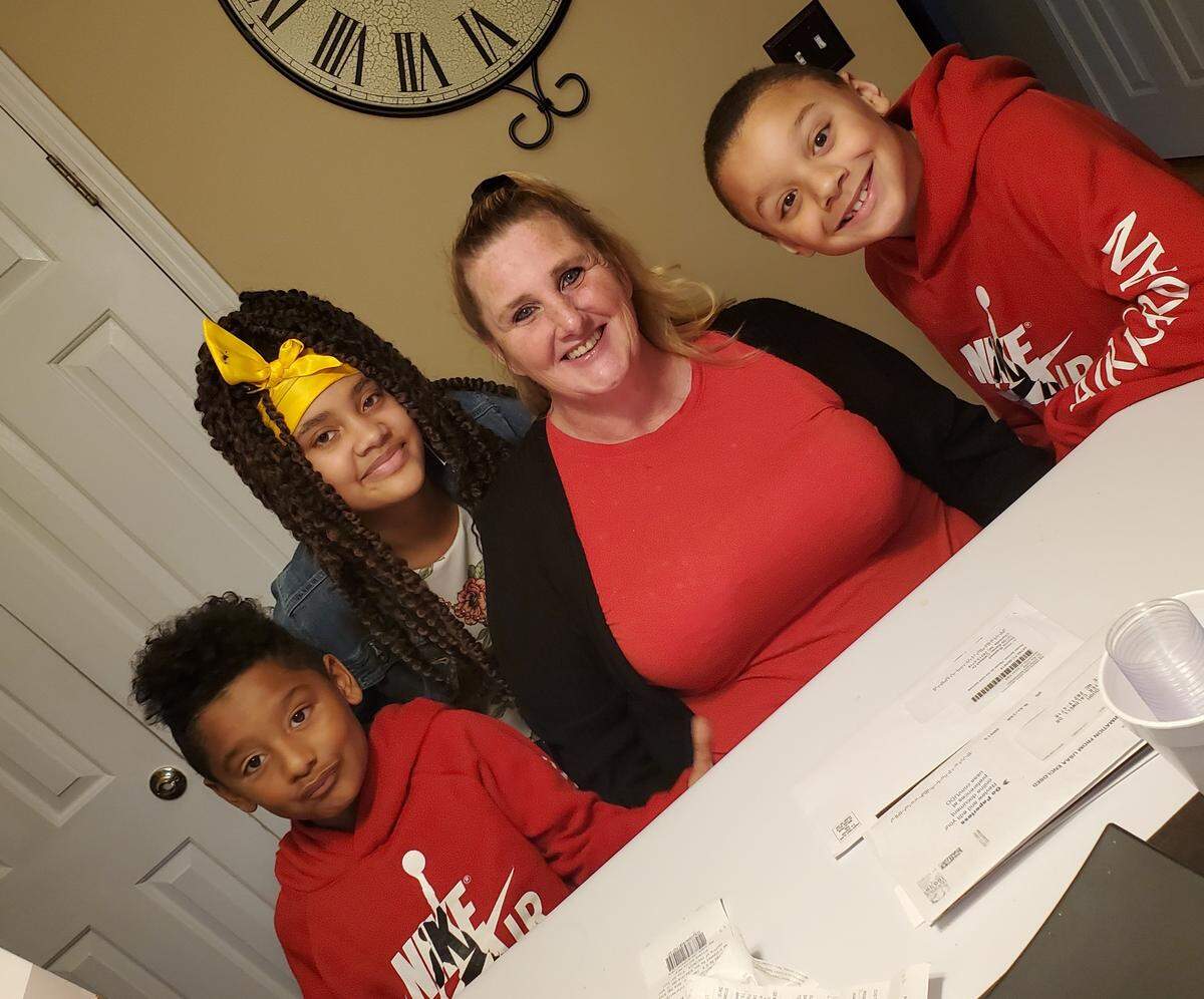 Zyh’aire Surls, E’onne Smith, Elizabeth McNiel and Anthony Surls, recipients of the Salvation Army Angel Tree program six years ago, became sponsors this year.