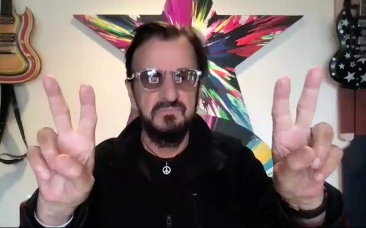 Ringo Starr answered reporters’ questions during a live, virtual interview earlier this year. He also frequently flashed the peace sign, part of his “Peace and Love” mantra.