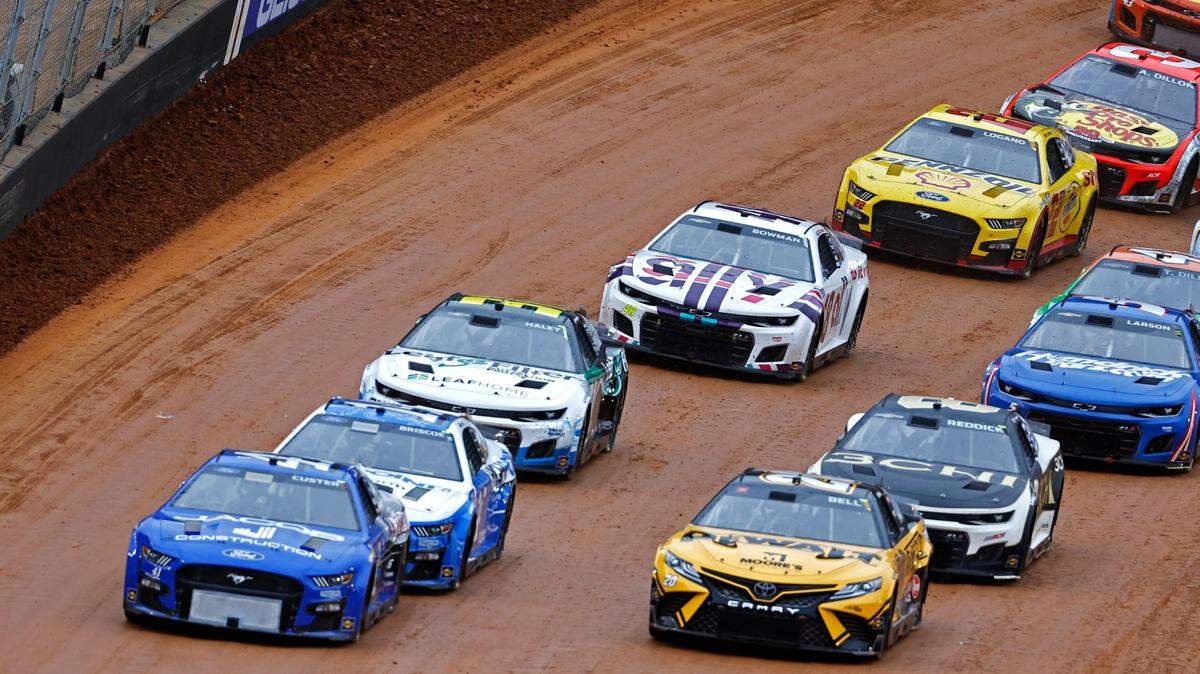 Driver Cole Custer (41) and driver Christopher Bell (20) lead the field to the start line during a NASCAR Cup Series auto race, Sunday, April 17, 2022, in Bristol, Tenn. (AP Photo/Wade Payne)