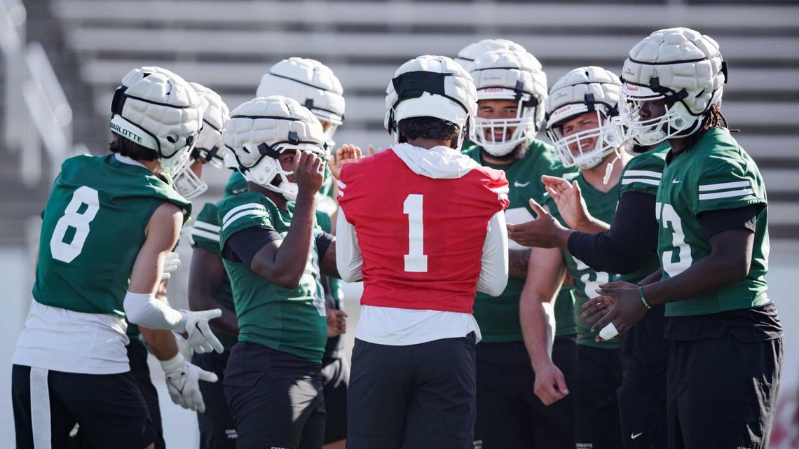 Charlotte 49ers’ starting quarterback Max Brown (1) huddles with his offense during the final intrasquad game at Jerry Richardson Stadium Saturday August 24, 2024.