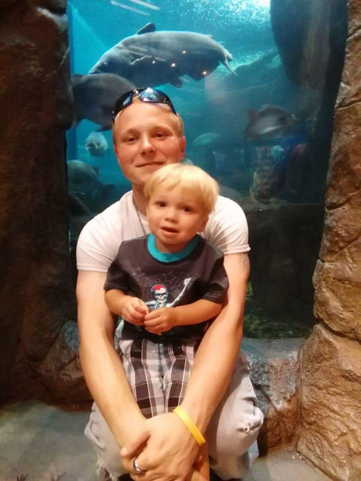 Billy Bullabough holding his three-year-old son Jameson at Concord Mils in 2016.