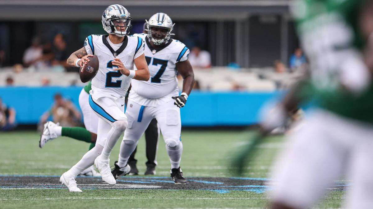 Panthers quaterback Matt Corral, left, scans the field during the pre-season game against the Jets at Bank of America Stadium on Saturday, August 12, 2023 in Charlotte, NC.