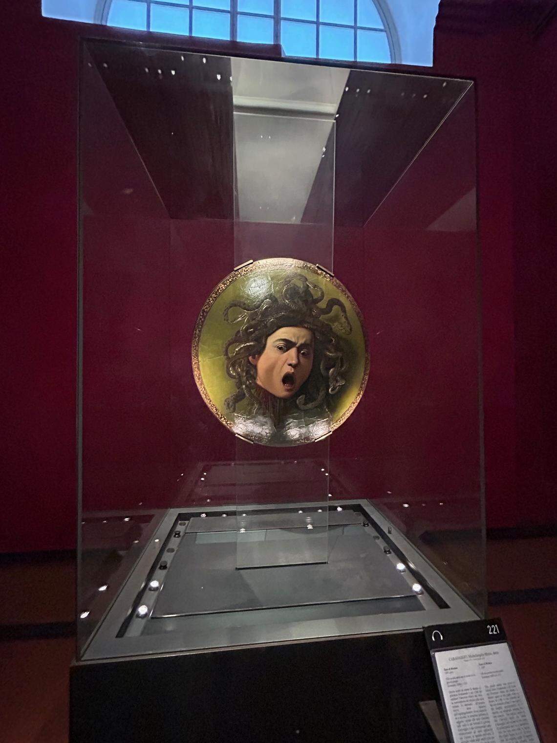 This Caravaggio masterpiece, the head of “Medusa,” as seen in the Uffizi Gallery, Florence. This is an oil on canvas mounted on a wooden shield, painted in 1597-1598.