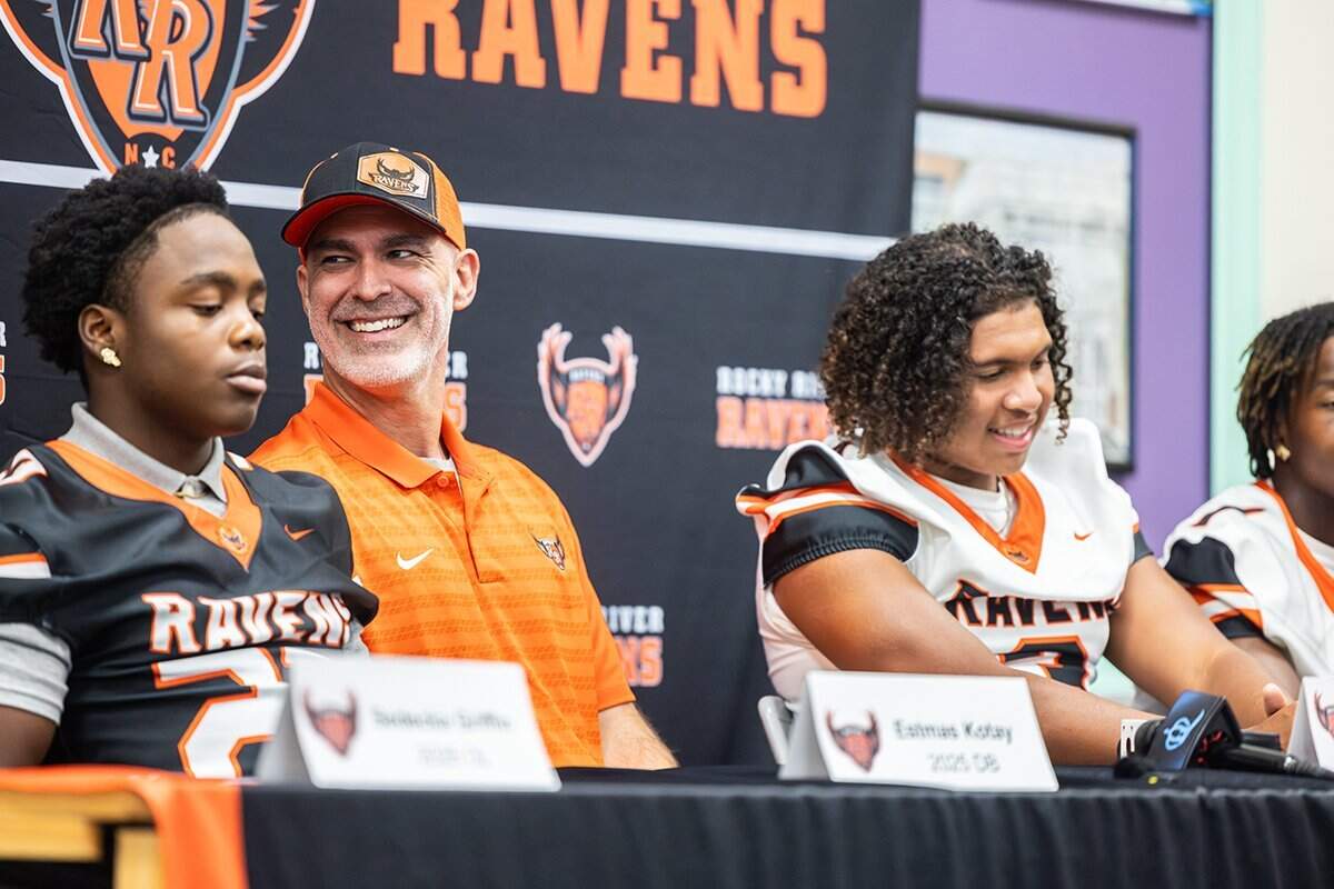 Rocky River coach Kenneth McClamrock speaks with players during media day at Rocky River High School in Mint Hill, N.C., on Monday, July 29, 2024.