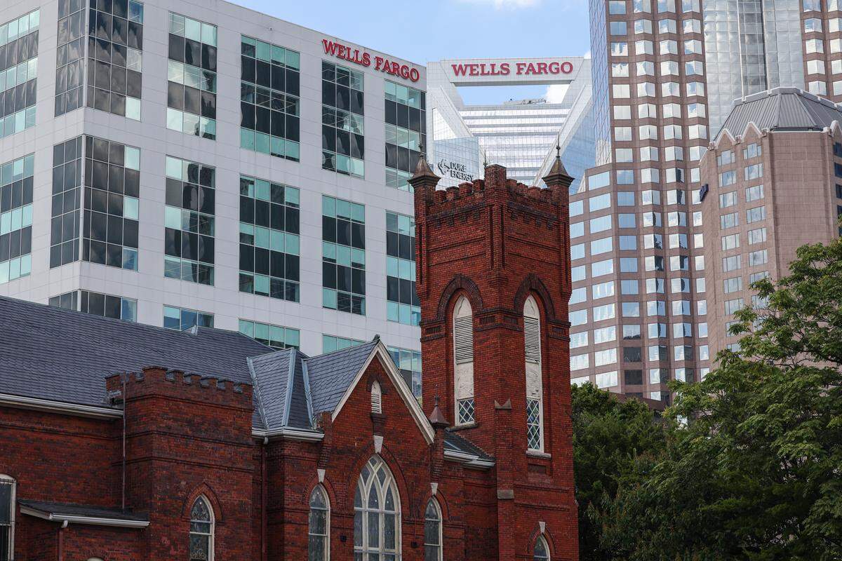 Corporate skyscrapers line the background of Grace AME Zion Church on South Brevard Street in Charlotte, a city where remnants of the city’s past sometimes sharply contrast with the gleaming, new buildings nearby. That’s if the older buildings have been preserved.