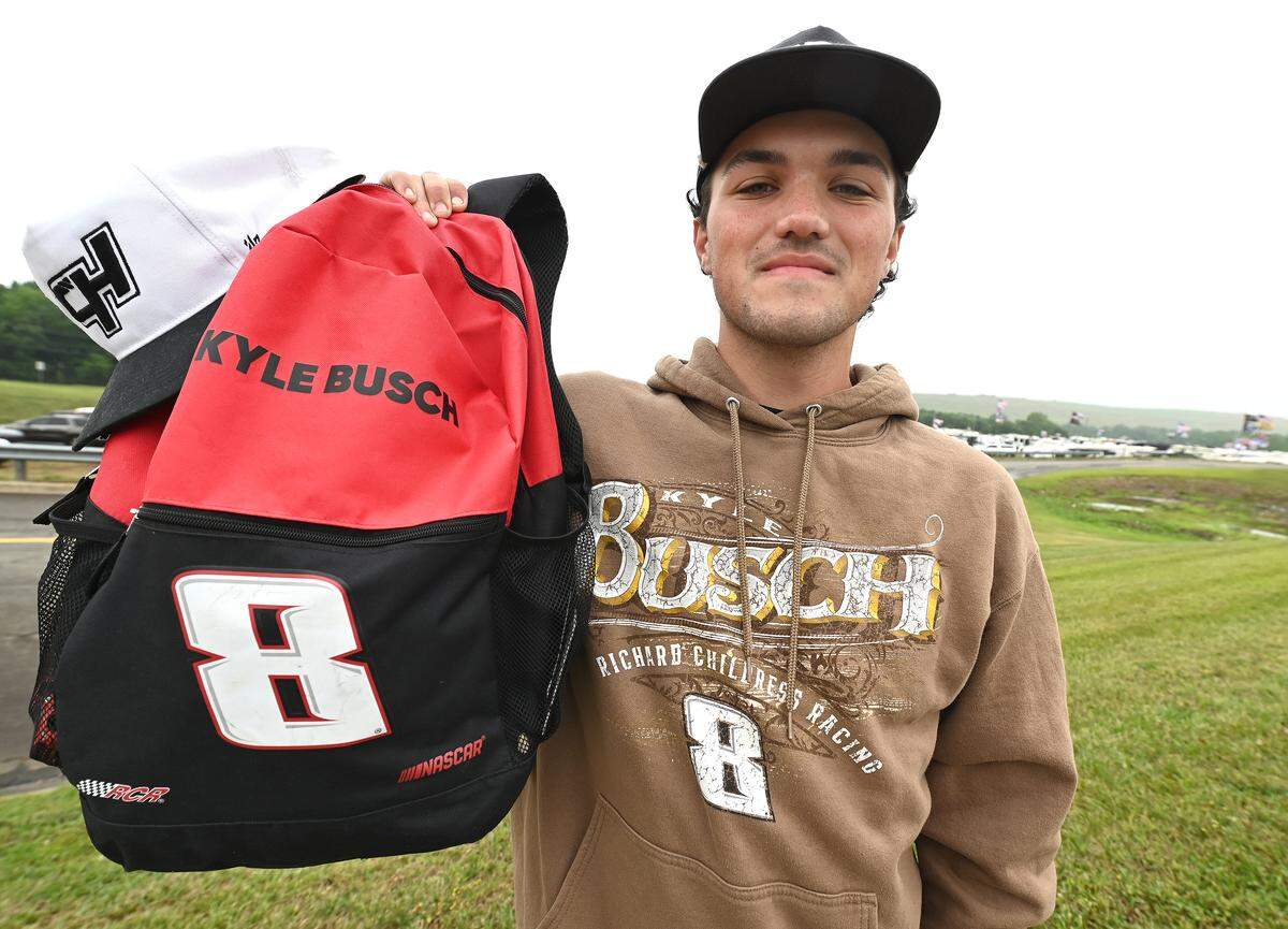 Josh Privette of Charleston, SC says that he cried for two hours last night after learning of NASCAR driver Kyle Busch’s unexpected death due to illness. Privette continues represent the driver by wearing and carrying various gear around Charlotte Motor Speedway in Concord, NC on Friday, May 22, 2026.