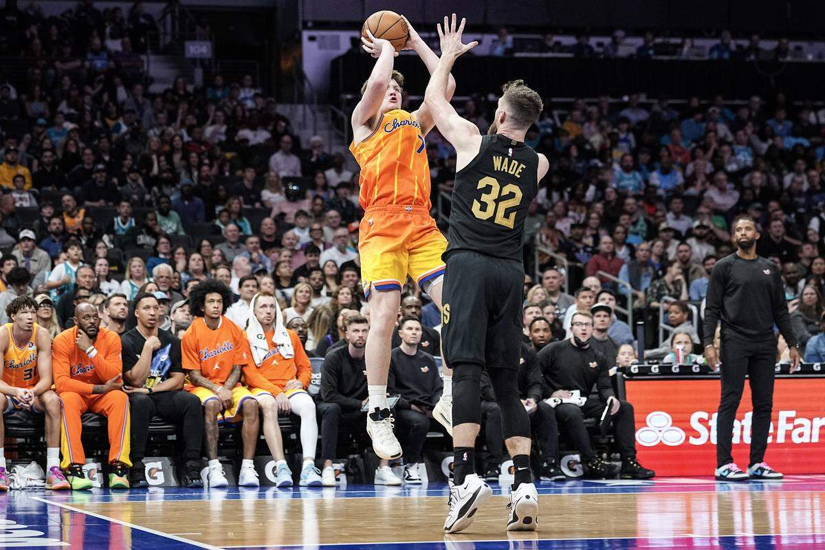 Charlotte Hornets guard Kon Knueppel (7) shoots over Cleveland Cavaliers forward Dean Wade (32) during the second half of an NBA basketball game, Friday, Feb. 20, 2026, in Charlotte, N.C.