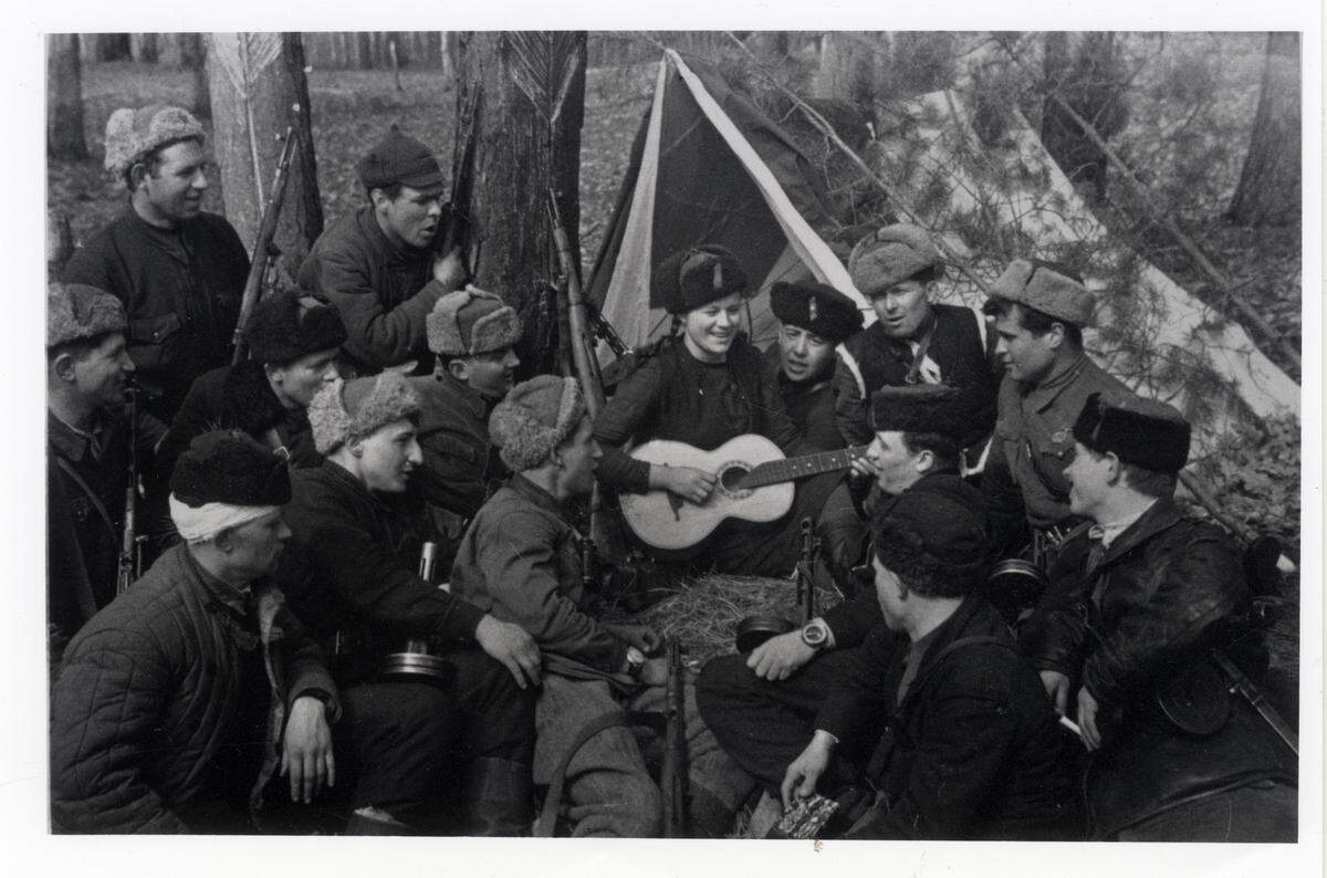 Soviet partisans in WWII singing during a lull in fighting.
