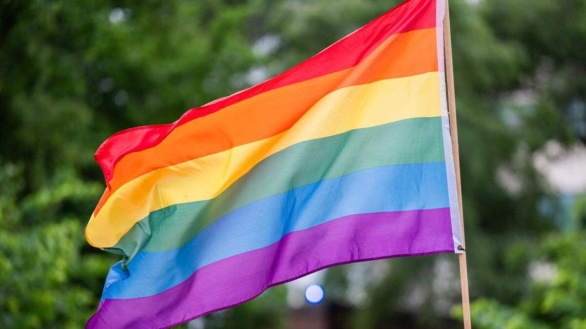 A Pride flag waves in the air during the KC Pride Parade along Mill Creek Parkway on June 7 in Kansas City.