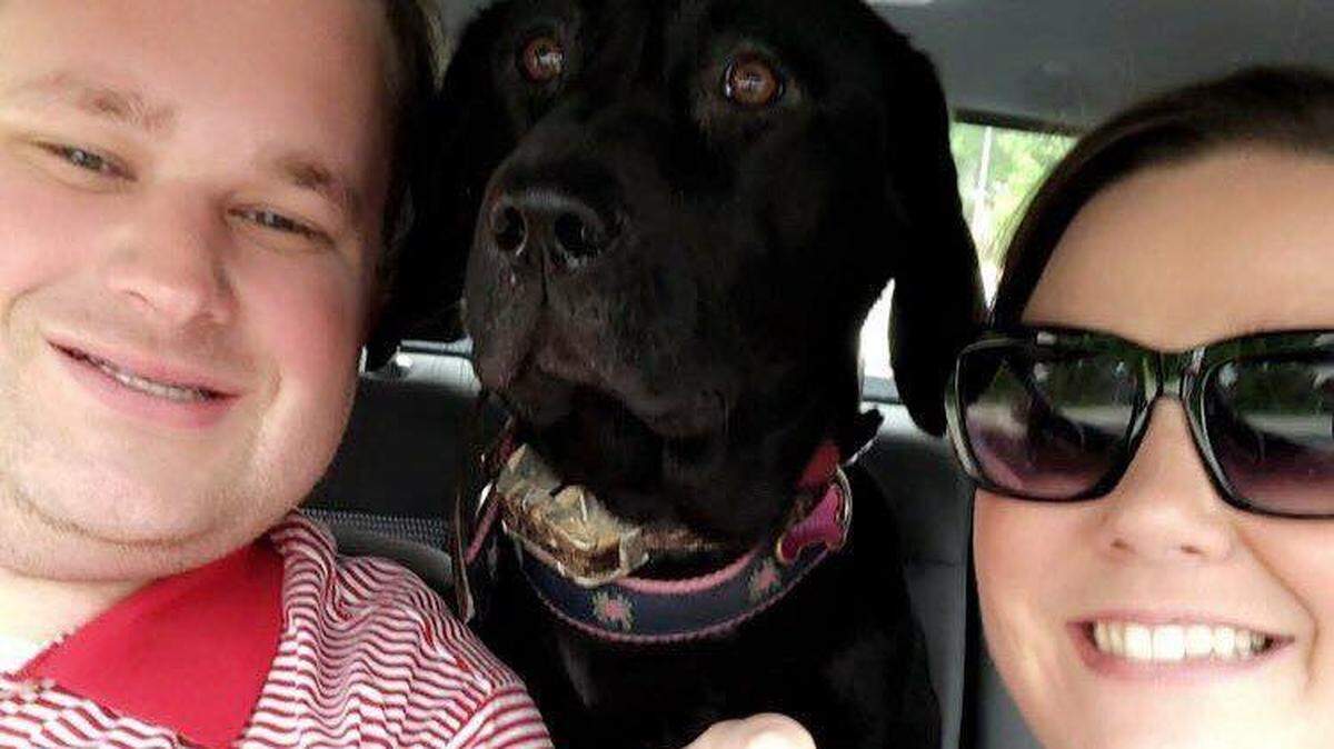 Charlie and Erin Morgan Beebe with their dog, Harper
