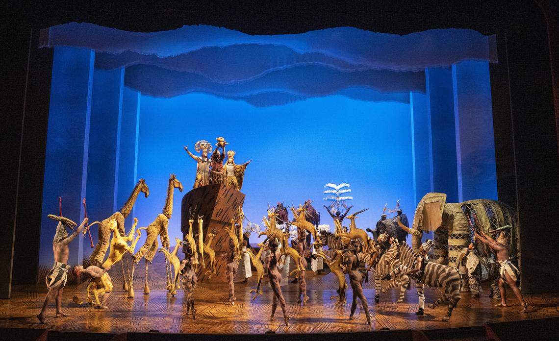 The company of “The Lion King” during “The Circle of Life.” Julie Taymor intentionally designed the animal costumes and puppets so the audience could see the people behind them, part of the poetry of live theater.