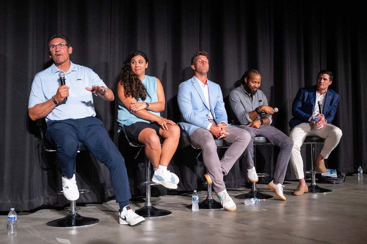 Former Carolina Panthers head coach Ron Rivera, left, speaks during the a panel discussion following the premiere of Super Men at Charlotte’s Independent Picture House on Thursday, July 24, 2025.