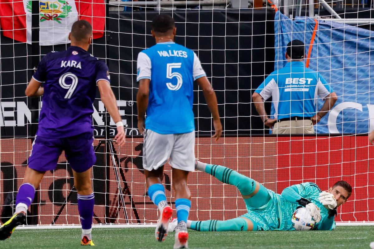 Charlotte FC goalkeeper Kristijan Kahlina (1) makes a stop against Orlando City in the first half in Charlotte, N.C., Sunday, Aug. 21, 2022.