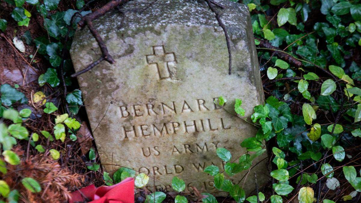 A gravestone at Cedar Grove Cemetery in west Charlotte. The 1.8-acre cemetery has been abandoned for the past 50 years, but volunteers have been clearing the site over the past two years.