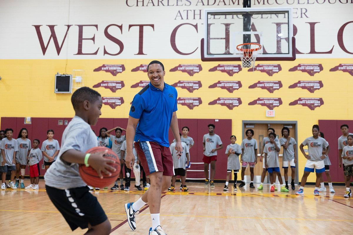 Dallas Mavericks Grant Williams and former Providence Day basketball player plays kids one on one at his basketball camp at West Charlotte High School in Charlotte, N.C., on Friday, July 21, 2023.
