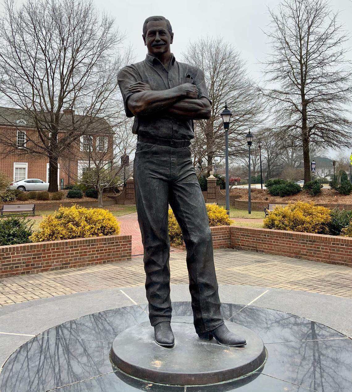 A nine-foot, 900-pound statue of Dale Earnhardt sits alongside Main Street in his hometown of Kannapolis, N.C. The statue was originally erected in 2002.
