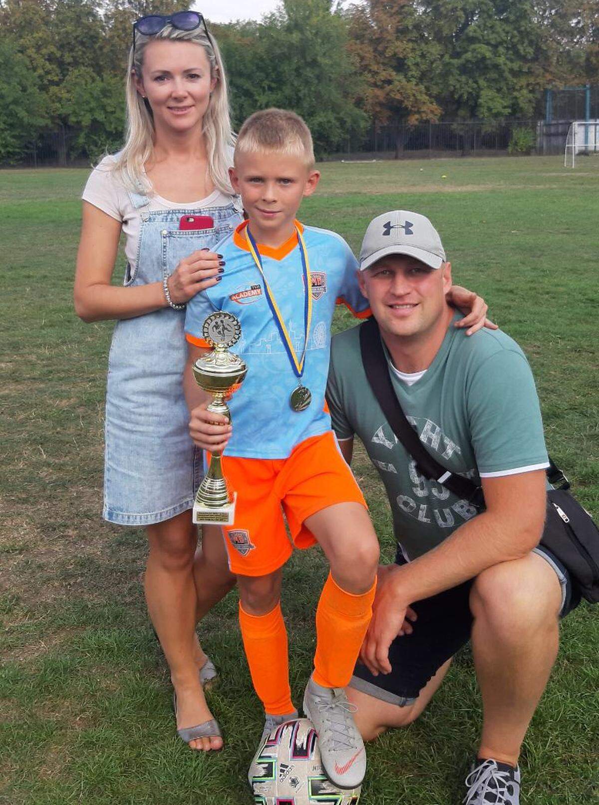 Olga, Misha and Ihor in a family photo taken prior to the start of the war in Ukraine.
