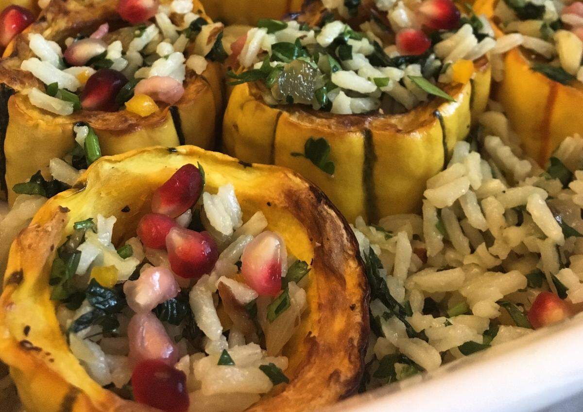 Shai Fargian, chef of Yafo Kitchen makes rice, pomegranate and almond-stuffed delicata squash at Thanksgiving.