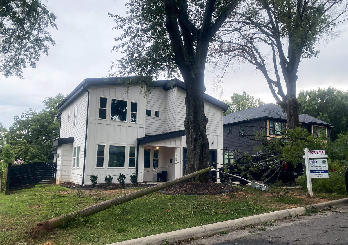 A street light fell into the yard of a house on Phillips Avenue in South Charlotte after strong storms passed through the area on Friday afternoon.