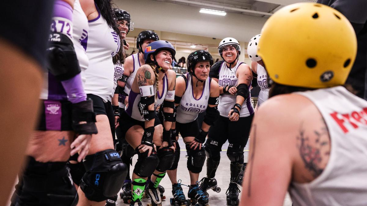 Charlotte Roller Derby huddles before their game against Collision in Charlotte on March 11, 2023.
