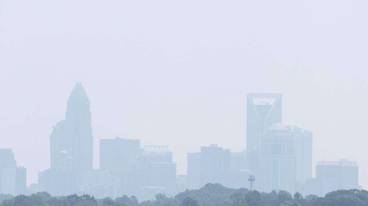 The Charlotte, NC skyline is blanketed in a haze on Wednesday, June 28, 2023. The high temperature will be near 90 degrees with an air quality alert.
