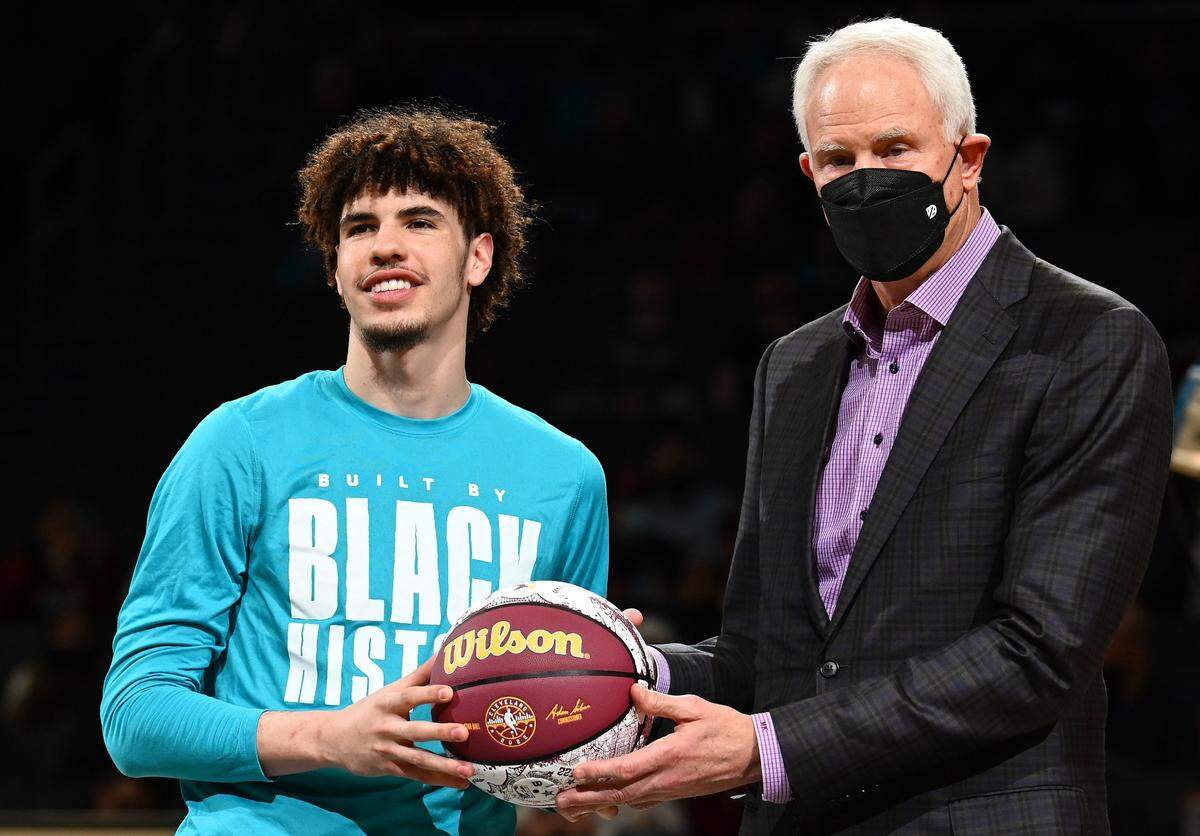 Charlotte Hornets guard LaMelo Ball (left) needs to work on getting stronger and playing better defense, according to general manager Mitch Kupchak (right).