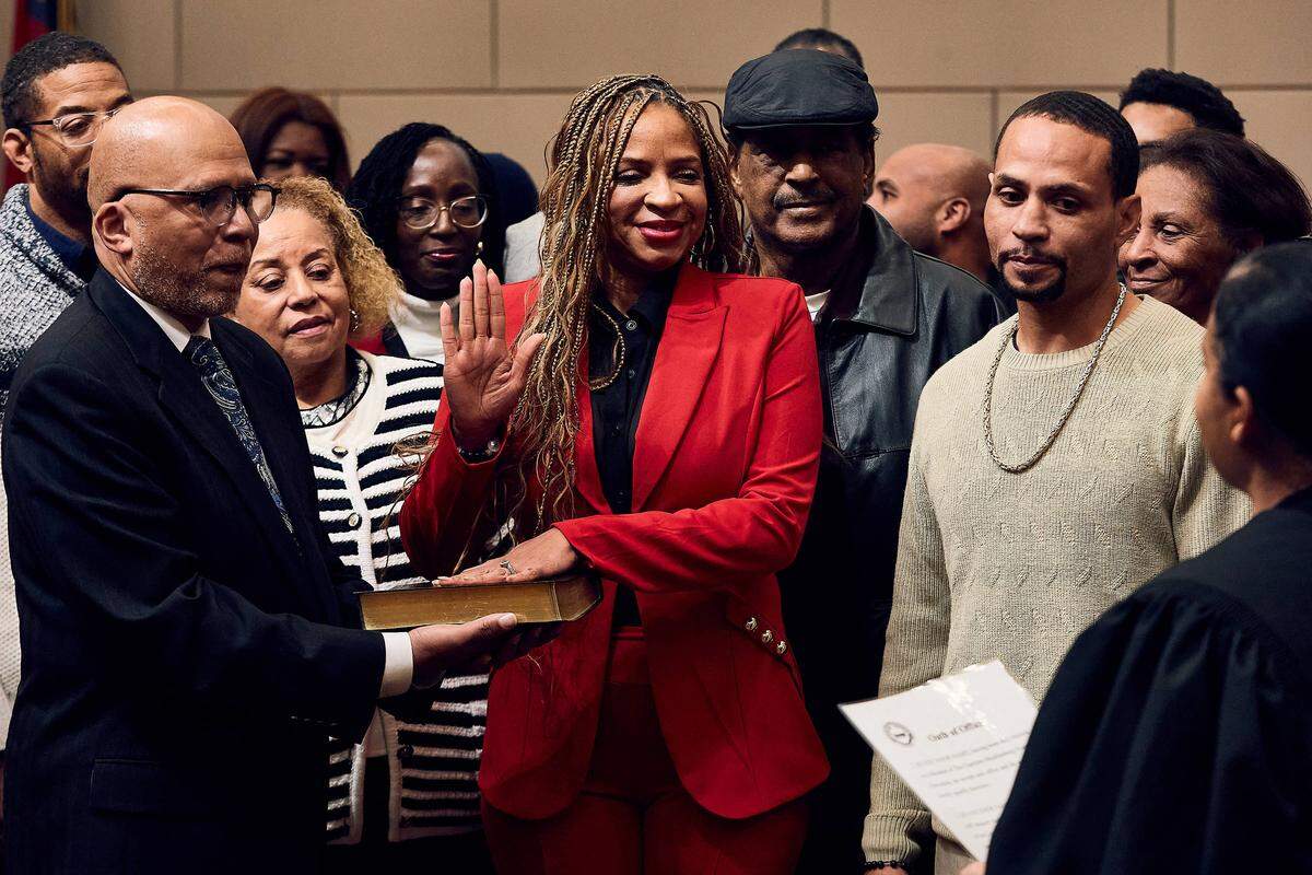 Stephanie Sneed, a returning board member for Charlotte-Mecklenburg Schools' District 4, is sworn in to her position surrounded by family and friends on December 9, 2025.