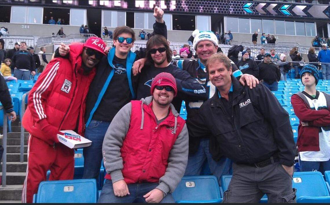 A photo of the late Lewis Cauthen III and friends at a Carolina Panthers game in Bank of America stadium. Lewis’ sons, Jackson and Benjamin, are going to the Panthers-Giants game in Germany 2024 to honor their father’s memory.