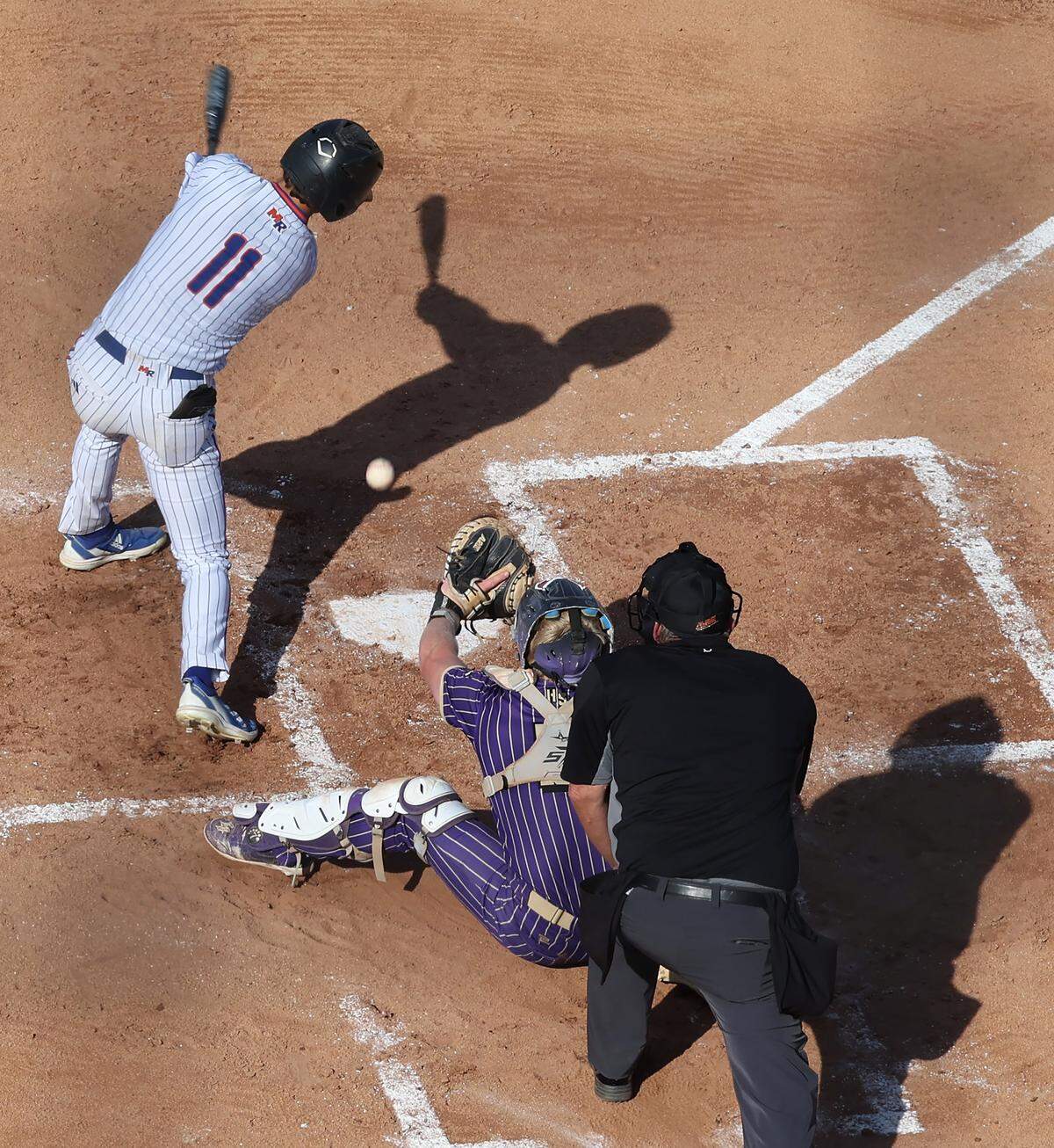 Marvin Ridge Mavericks batter Alex Culicerto is unable to get around on a Holly Springs Hawks’ pitch during Game 1 of the NCHSAA 7A Baseball Championship at the Burlington Athletic Stadium on Friday, May 29, 2026 in Burlington, NC. Holly Springs defeated Marvin Ridge 3-1.