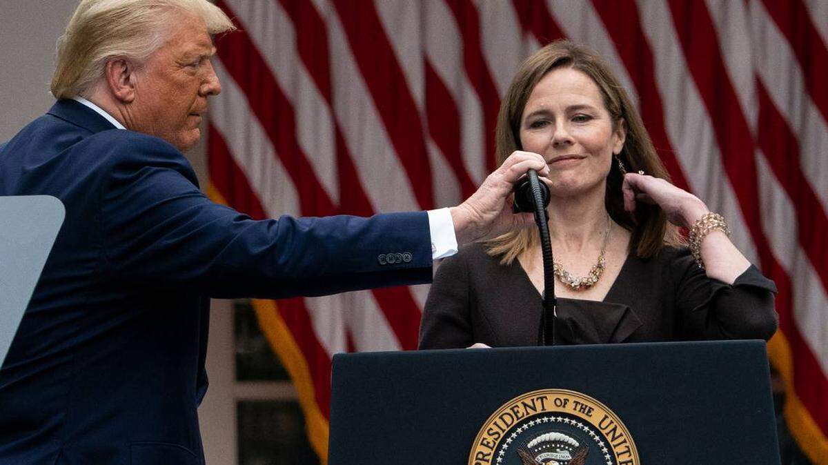 President Donald Trump adjusts the microphone after he announced Judge Amy Coney Barrett as his nominee to the Supreme Court during a Sept. 26 event in the Rose Garden at the White House.