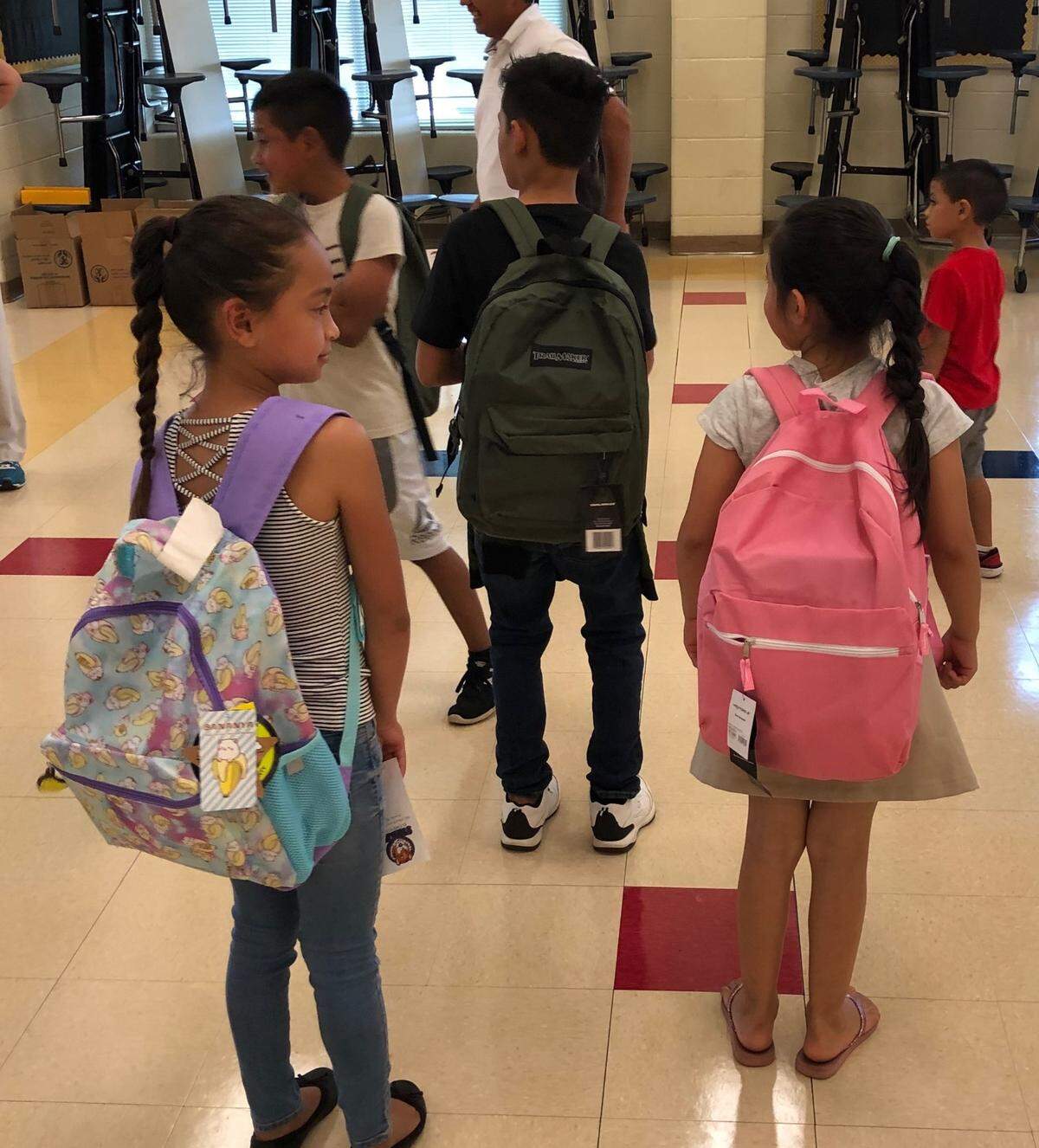 Students at Sterling Elementary School wearing backpacks.