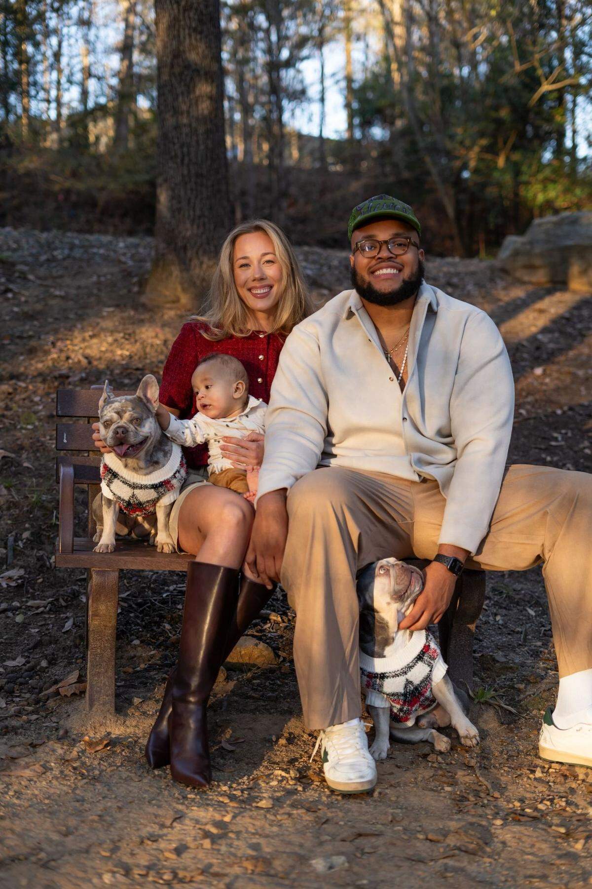 Carolina Panthers guard Robert Hunt (right) poses with wife, Julia, and son, Skye.
