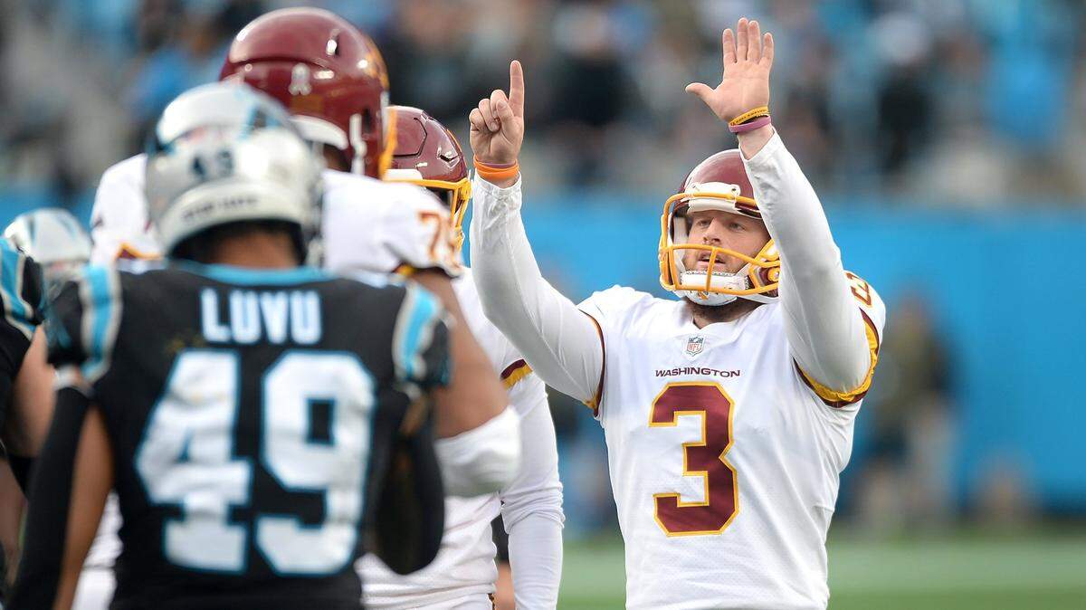 Washington football team kicker Joey Slye signals six after kicking a field goal against the Carolina Panthers during fourth quarter action at Bank of America Stadium in Charlotte, NC on Sunday, November 21, 2021. Washington defeated the Panthers 27-21.
