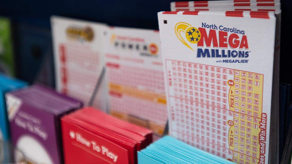 Mega Millions lottery tickets sit in rows at a gas station on Thursday, July 28, 2022.