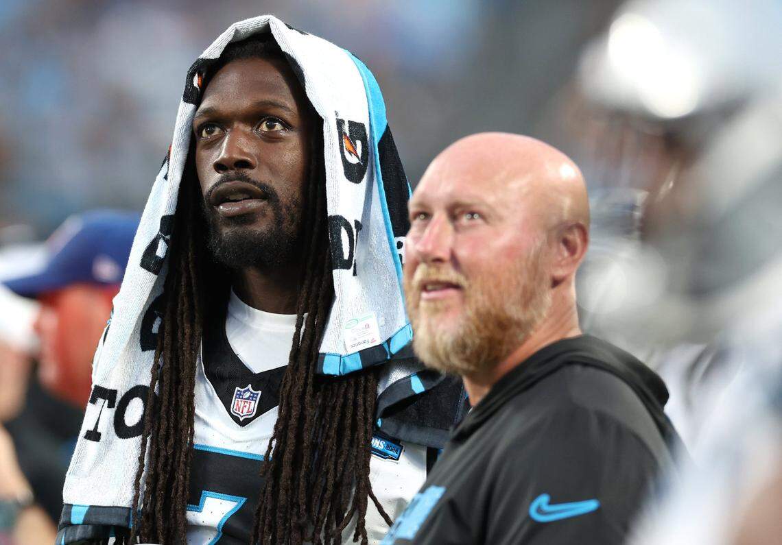 Carolina Panthers linebacker Jadeveon Clowney (left) stands along the team’s sideline during second quarter action against the New York Jets at Bank of America Stadium in Charlotte, NC on Saturday, August 17, 2024.