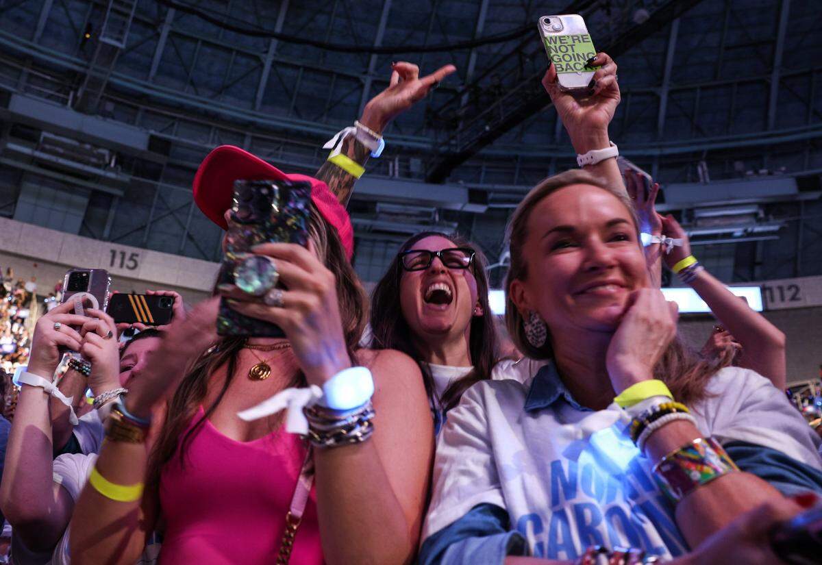 Supporters young and old cheer for Vice President Kamala Harris as she speaks during a rally at the Bojangles Coliseum in Charlotte, NC on Thursday, September 12, 2024.