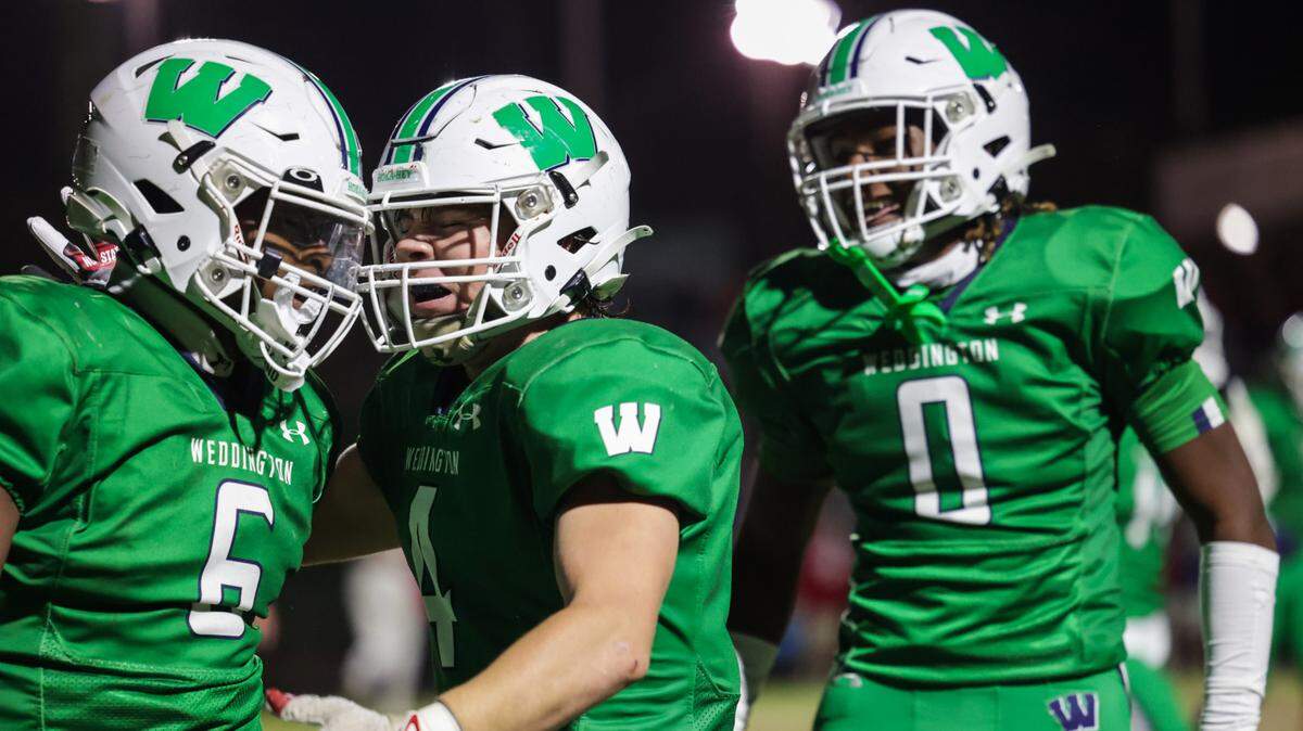 Weddington’s Aiden Harris (6) celebrates scoring two points on a safety with teammates Gannon Anthony (4) and TJ Davis (0) during the third round of the NC 4A playoffs against Charlotte Catholic at Weddington High School on Friday, November 17, 2023.