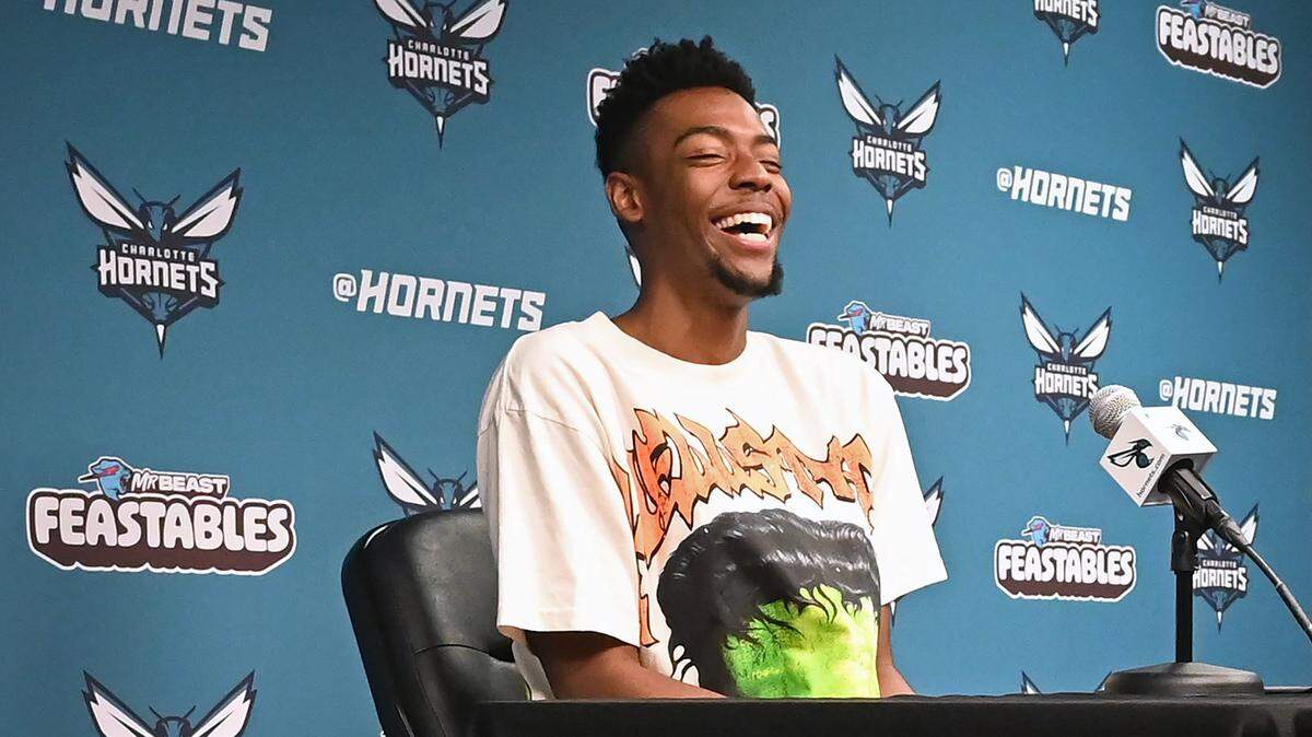 Charlotte Hornets guard/forward Brandon Miller laughs as he responds to a question during an interview with local media at Spectrum Center on Monday, April 15, 2024.
