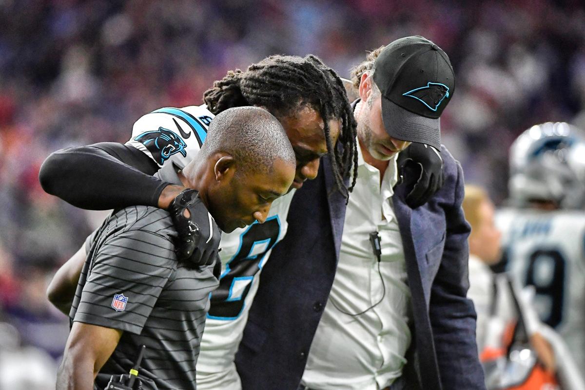 Carolina Panthers cornerback Jaycee Horn (8) is helped off the field after an injury in Houston Thursday night. Horn broke three bones in his foot and may be sidelined the rest of the season.