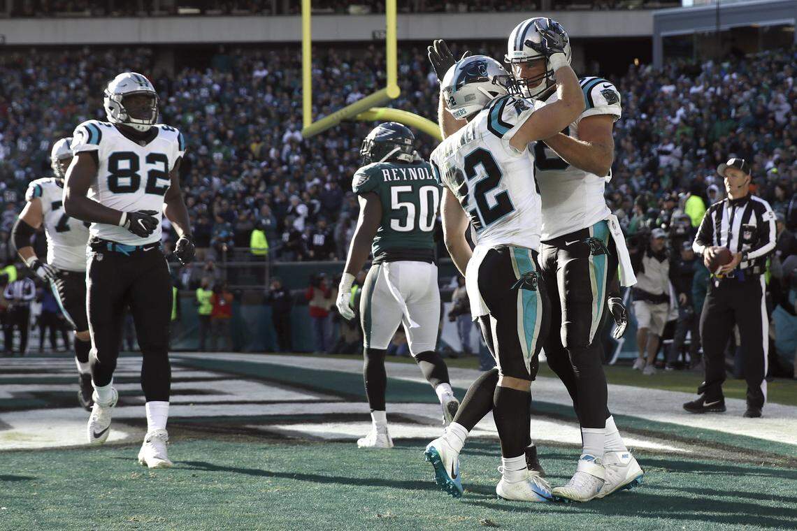 Carolina Panthers tight end Greg Olsen, right, celebrates his touchdown catch with Christian McCaffrey during the second half of an NFL football game against the Philadelphia Eagles, Sunday, Oct. 21, 2018, in Philadelphia. Two big catches from McCaffrey set up the play, which was the go-ahead score in Carolina’s comeback victory. (AP Photo/Matt Rourke)