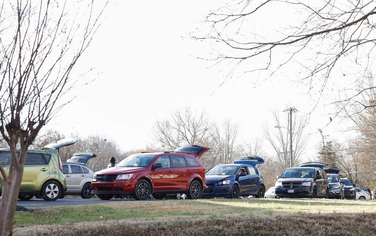 Cars often start lining up as early as Wednesday afternoon for the free food given out at Mount Zion Restoration Church on Thursdays.