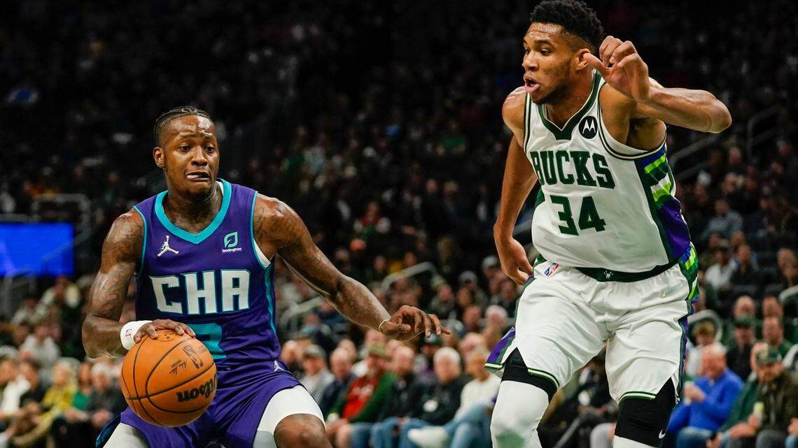 Charlotte Hornets’ Terry Rozier tries to drive past Milwaukee Bucks’ Giannis Antetokounmpo during the first half of an NBA basketball game Wednesday, Dec. 1, 2021, in Milwaukee. (AP Photo/Morry Gash)