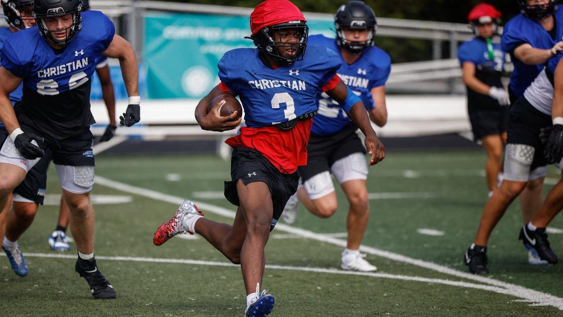 Charlotte Christian running back Jamal Rule, center, runs through a drill during football practice on Wednesday, August 22, 2024.