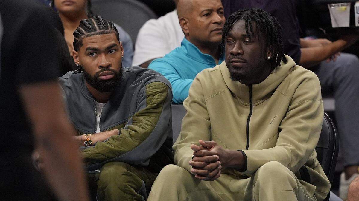 Charlotte Hornets center Nick Richards (4) and center Mark Williams (5) sit on the bench during the second quarter at Spectrum Center.